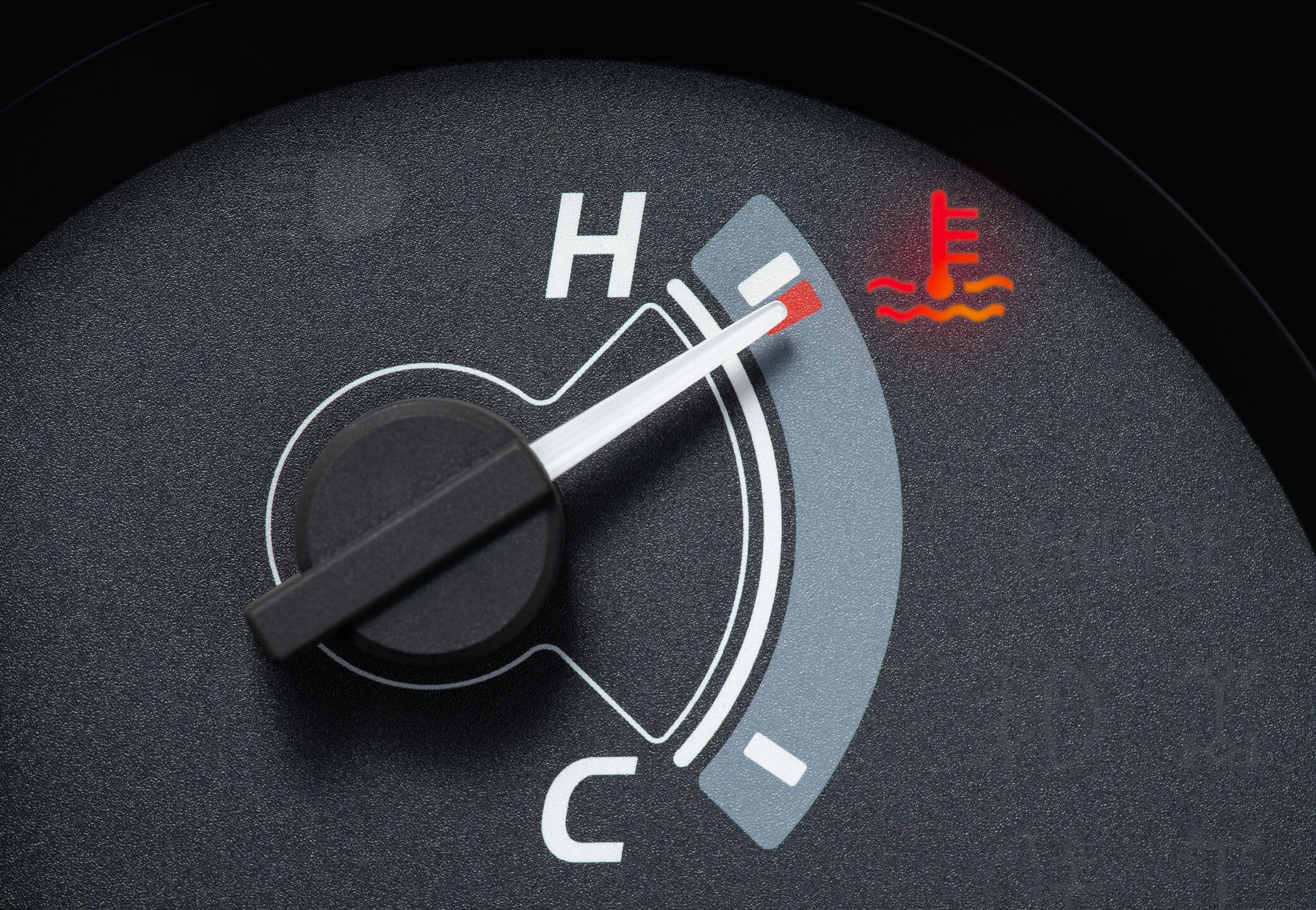 pointer at the high temp point of the temperature gauge in the vehicle radiator